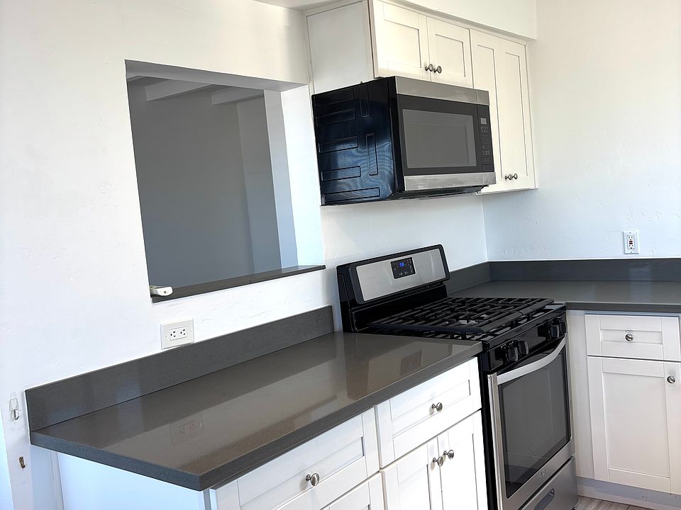 Kitchen - Stainless appliances. Gas stovetop and oven, microwave & dishwasher.