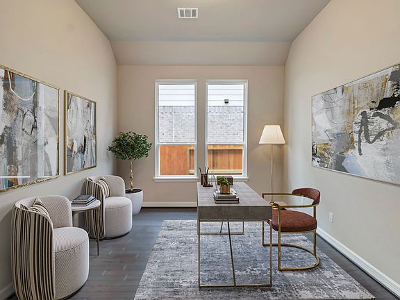 Study featuring luxurious flooring and large windows