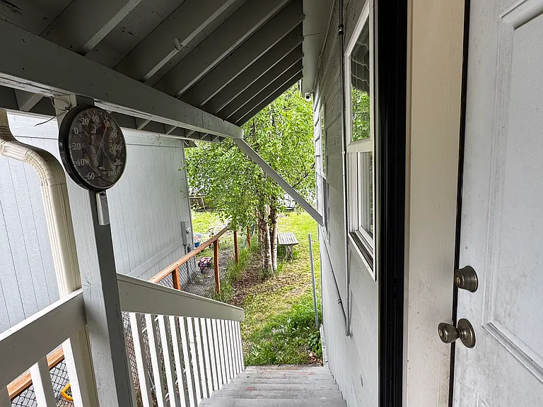 Back staircase to shared fenced in yard