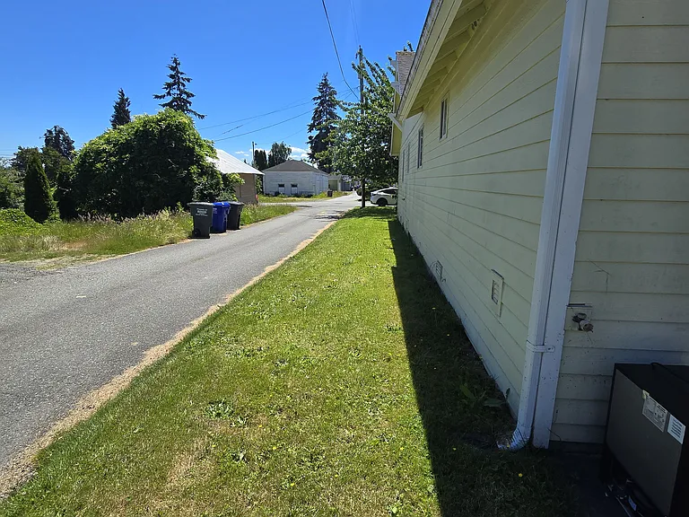 Parking on grass along side of home
