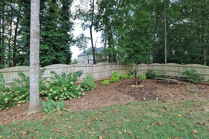 Professionally landscaped back fenced yard