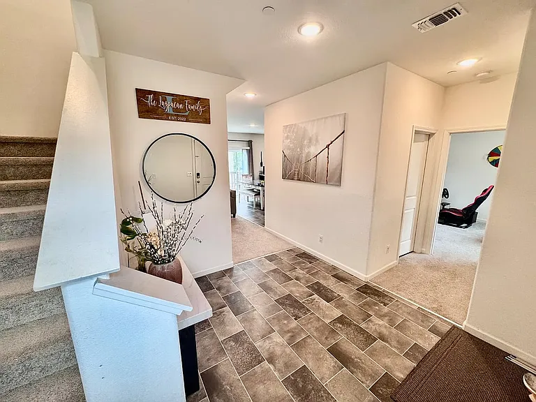 Entrance view to living and down bed & bath