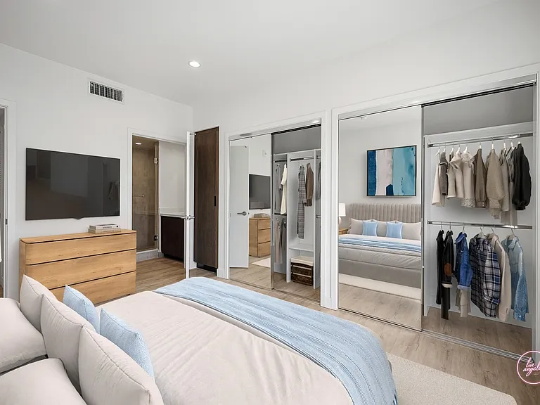 Secondary Bedroom with Two-Mirrored Closets, Cabinet Storage, and In-Suite Bathroom - Eagle Floor Plan