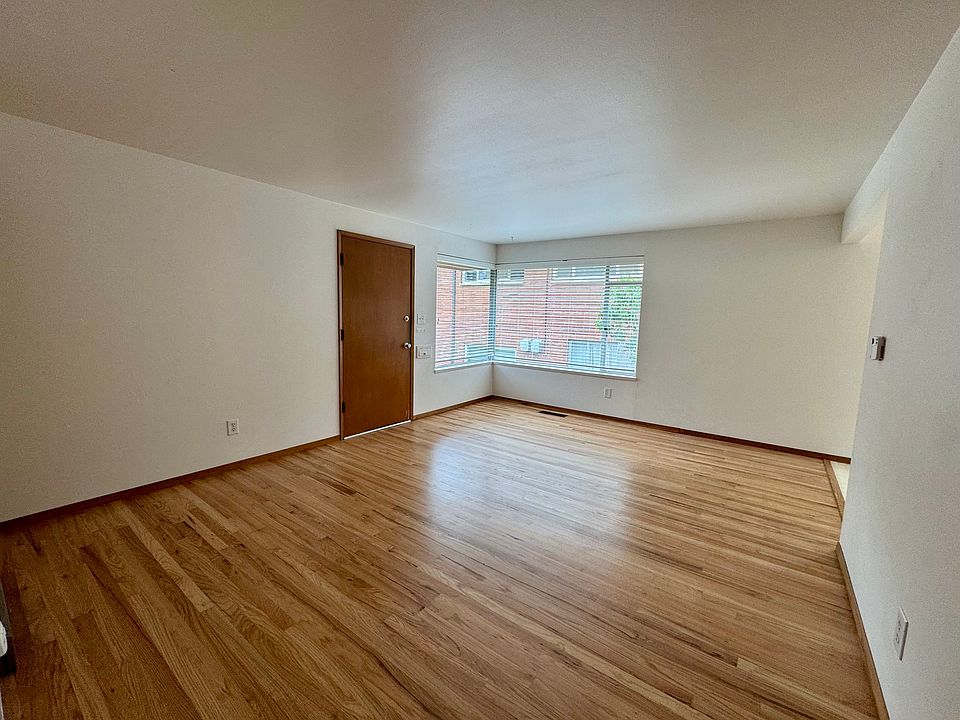 Living room w/new wood floors & freshly painted