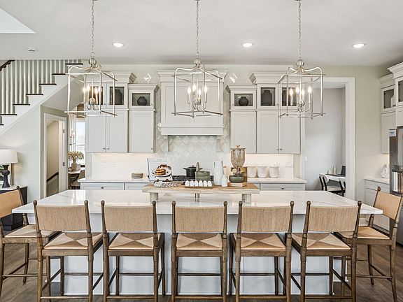 Kitchen with center island and white cabinets