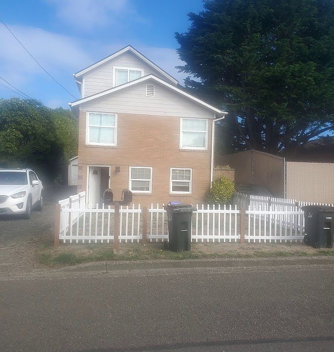 Front view with lower smaller home on the bottom. View windows and large home on the top two floors.