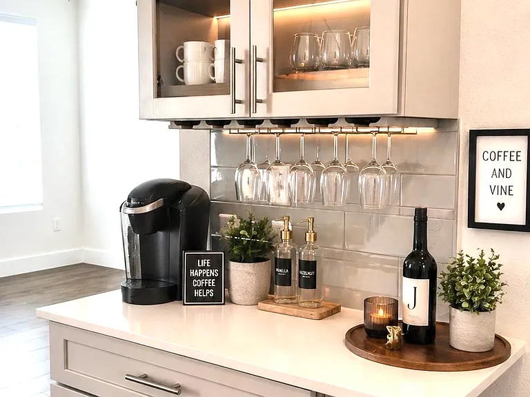 Built-in beverage station featuring shaker-style cabinetry, glass-front upper cabinets with quartz countertop, and a subway tile backsplash.