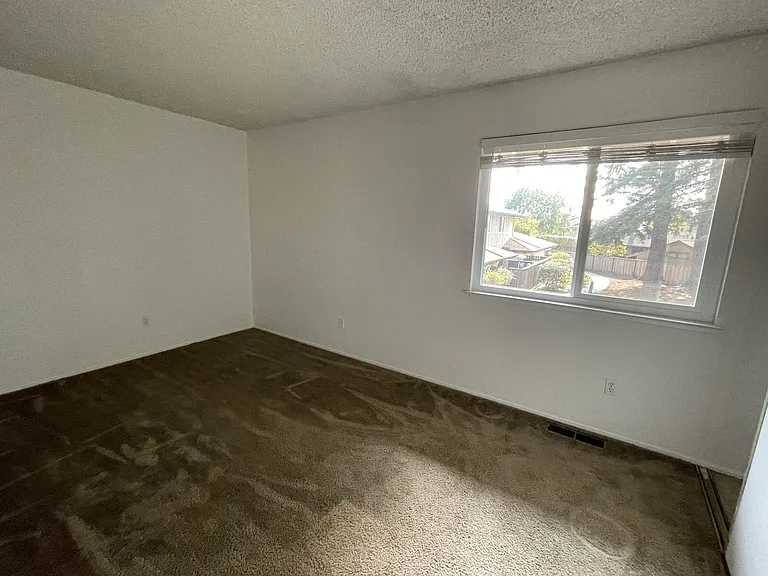 Smaller room, ideal for 1 person or 2 with bunk beds. Carpet has been replaced with wood laminate flooring.