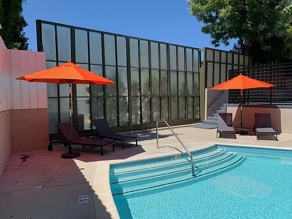 Swimming pool and outdoor seating.