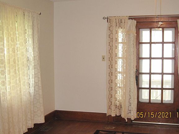 Living room w/ door to screened porch