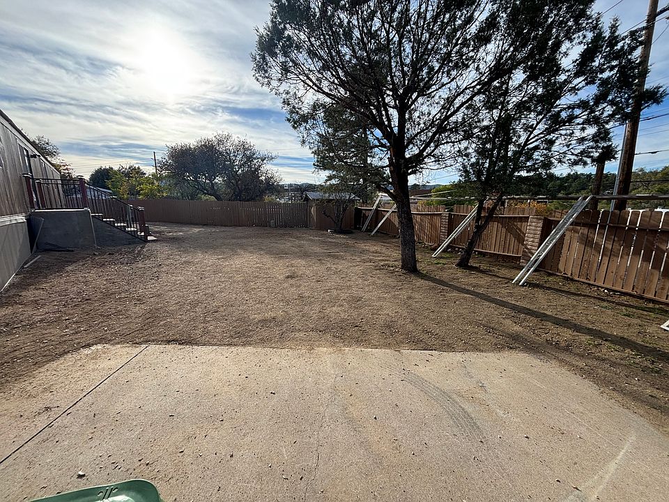 Large yard with mountain views, fully fenced.