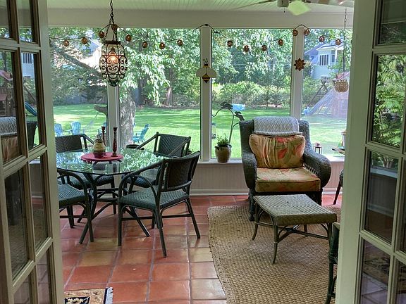 Large three season porch with dining and living area.