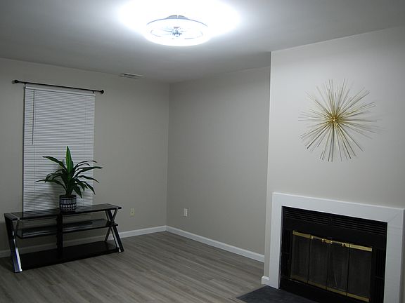 Bright, modern/spacious living area with hardwood floors ...