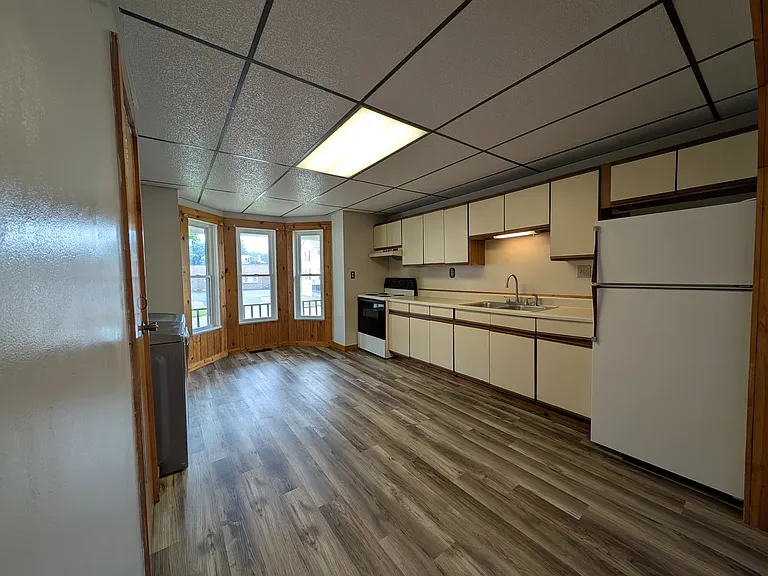 Open Concept Kitchen with stove, vent and refigerator
