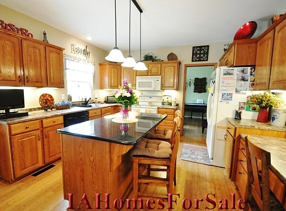 Kitchen with black onyx granite island.