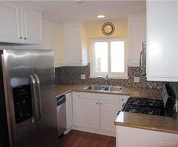 Upgraded kitchen with newer cabinets, granite counters & stainle