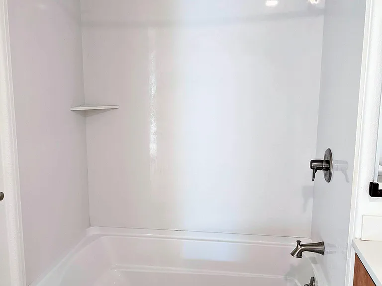 Hallway Bathroom with attached luxurious tub.