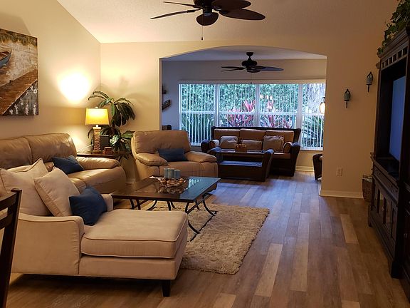 Living room furnished with leather reclining sofa and chair