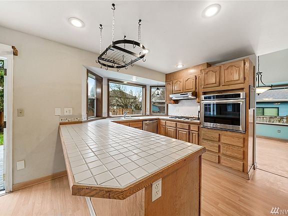 Great storage w/ gas cooktop & wall oven. Opens to Eating space & Dining Room. 
