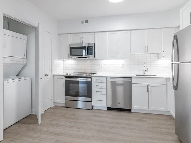 Kitchen with Stainless Steel Appliances and In-home Washer and Dryer