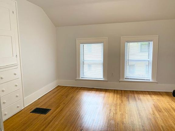 Middle upstairs bedroom with great built in cabinet, mirror and closet.