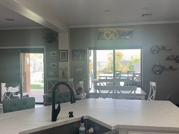 Kitchen facing dining room and backyard