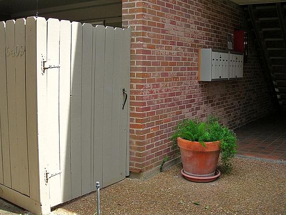 Unit #6409 is a ground-floor condo.  Great location with the building mailboxes located just outside this unit's patio gate.