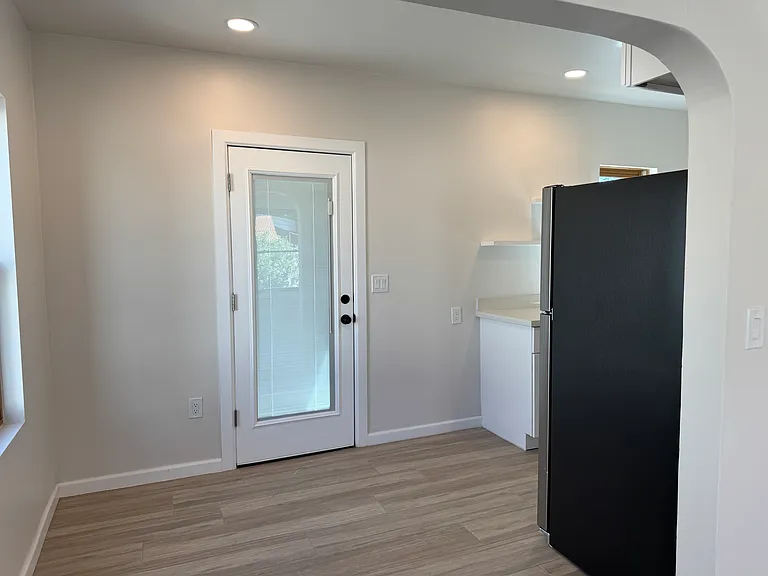 Dining Area with door to the rear covered porch and yard area