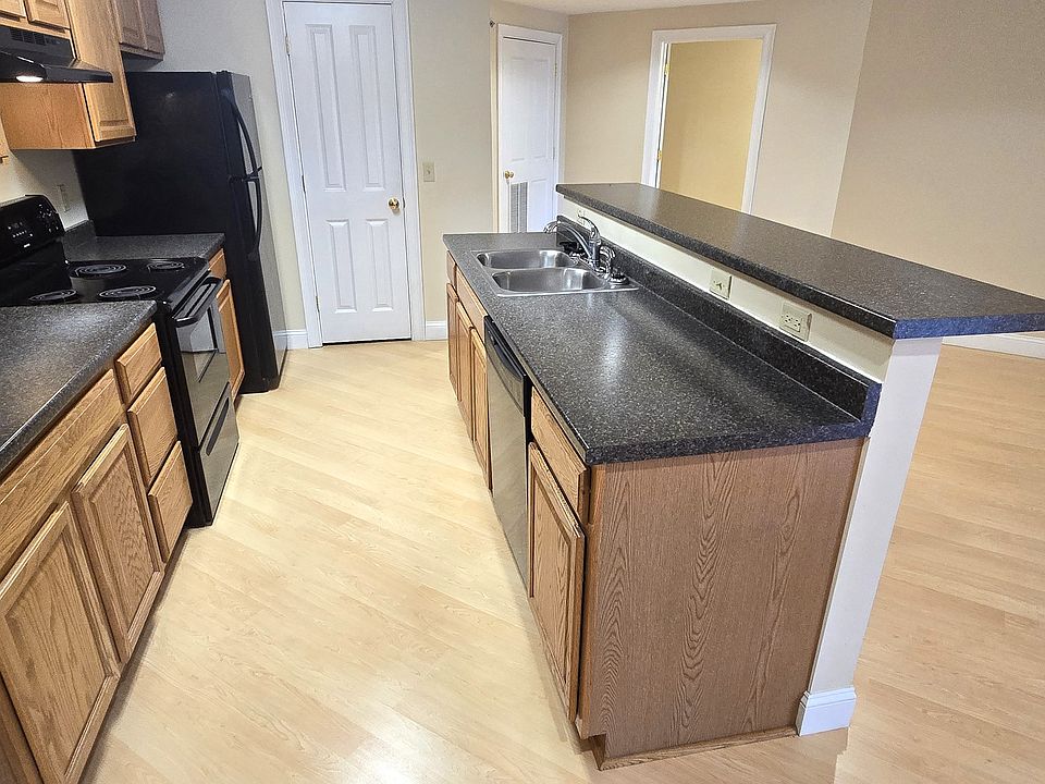 open concept kitchen with breakfast bar and dining area
