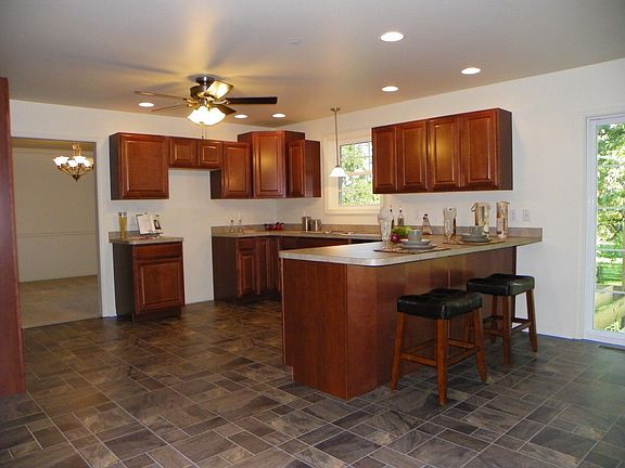 Featuring Stainless Appliances, Pantry & Brkfst Bar
