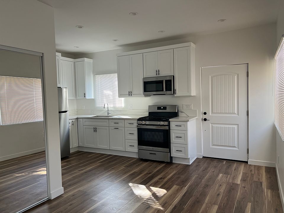 Kitchen and entry door, view from living area.