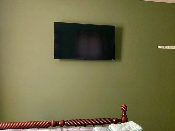 Also includes a wall mounted smart TV.