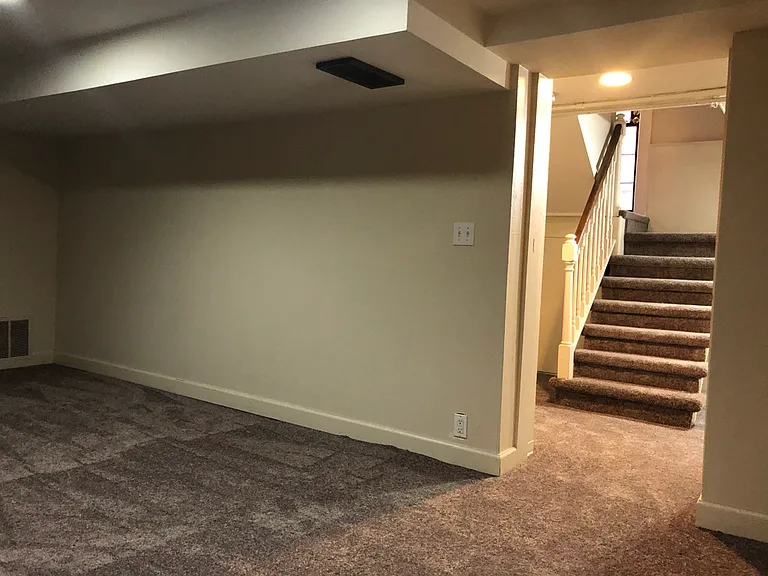 Basement living area with new carpet