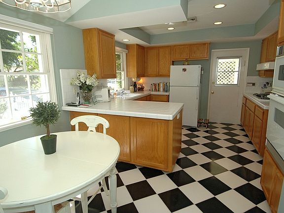 Kitchen with Classic Flooring and Sunny Breakfast Area