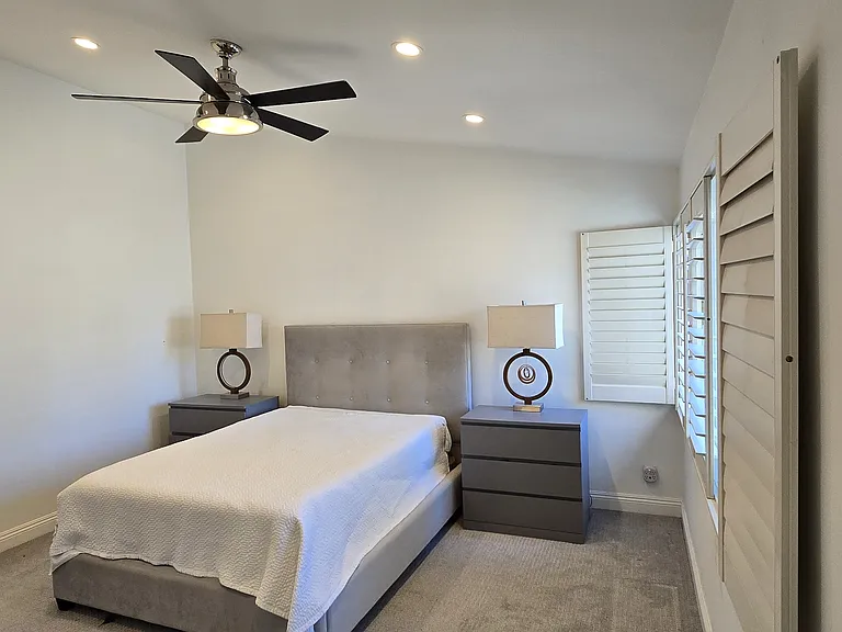 Spacious master bedroom with Walk in Closet. For reference, this bed is a queen size.