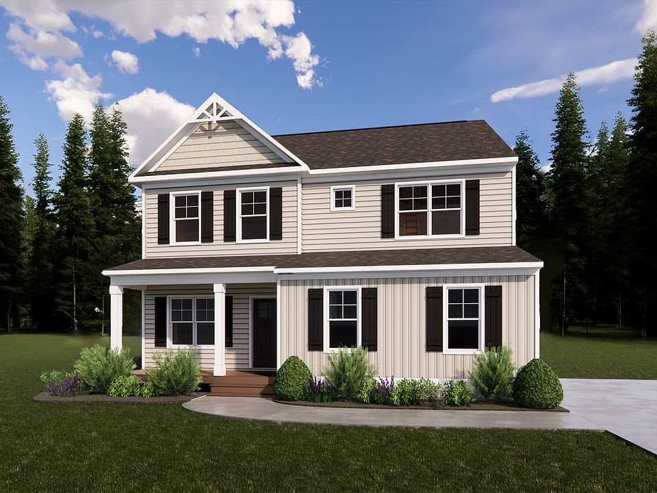 Located on Lot 31 in Poplar Village, this charming two-story house features beige siding, white trim