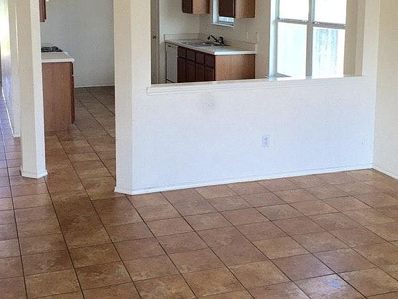 All tile floors. Fresh paint. Fireplace in living room