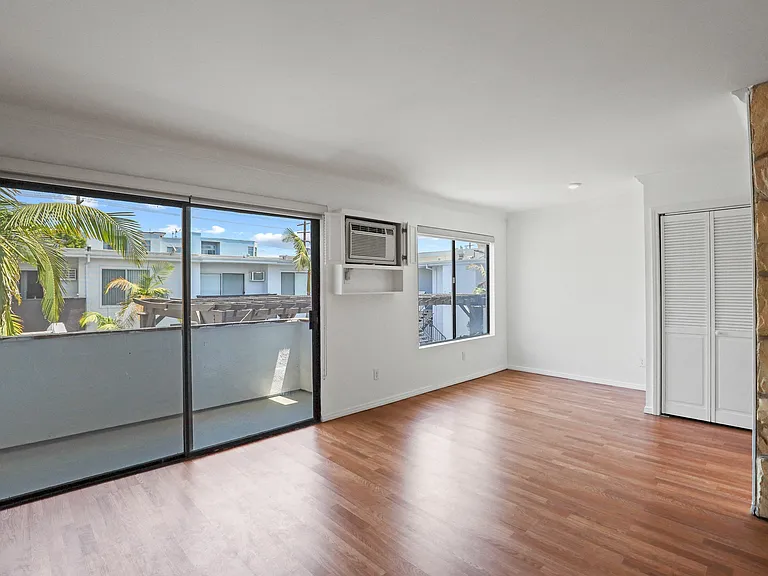 Open-Concept Dining and Living Room Area with Patio