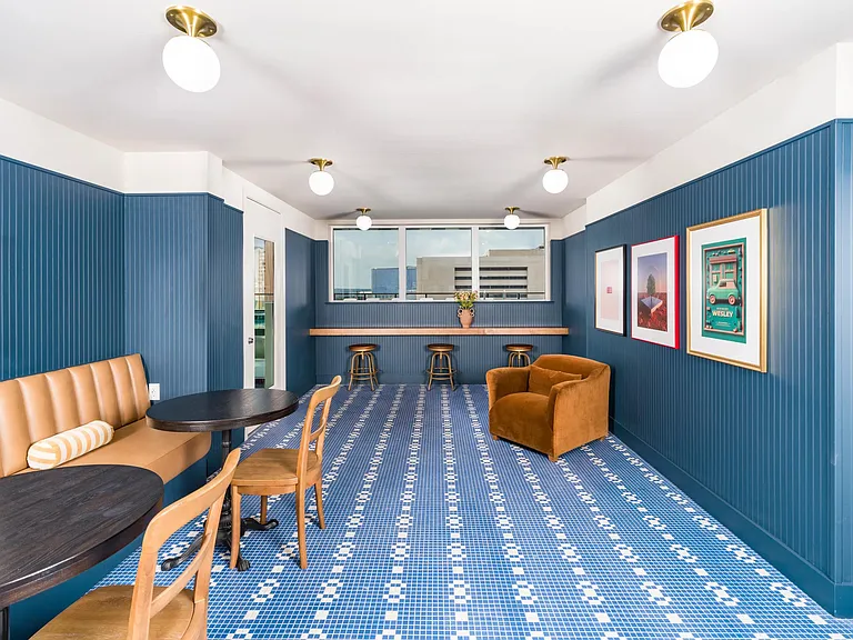 Colorful and inviting, the lounge at Modera St. Paul offers stylish seating and vibrant design, perfect for casual gatherings in downtown Dallas.