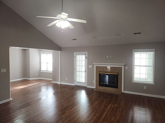Family room with fire place and view of side dining room