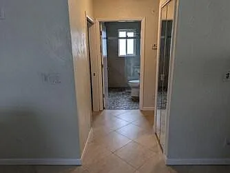 Hallway to bathroom and bedrooms
