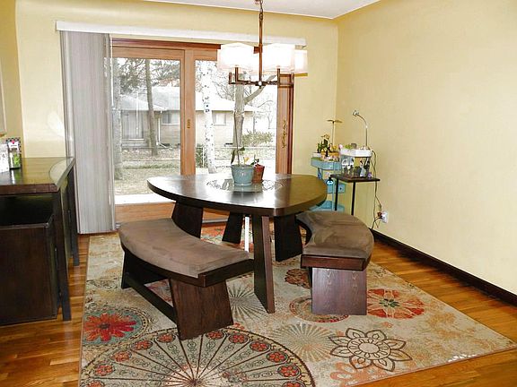 Dining room with hardwood flooring and large new sliding patio door.