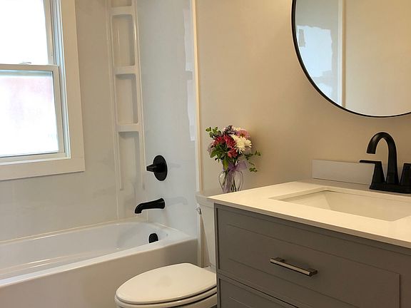 Brand new bathroom with medicine cabinet