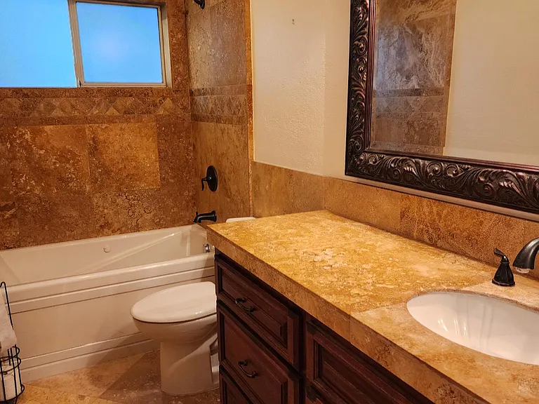 Travertine tiled bathroom