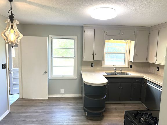 Second view of kitchen - notice windows to backyard and Mud room and patio entry doors to left.