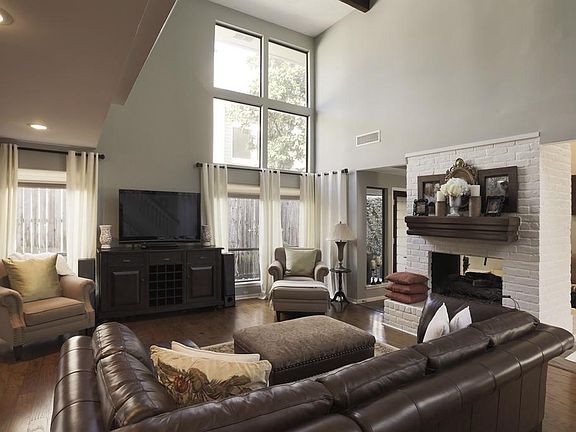 Additional view of the wonderful great room with views of the additional sitting area on the other side of fireplace.