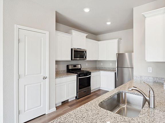 The kitchen of the Chatfield has sprawling granite countertops.