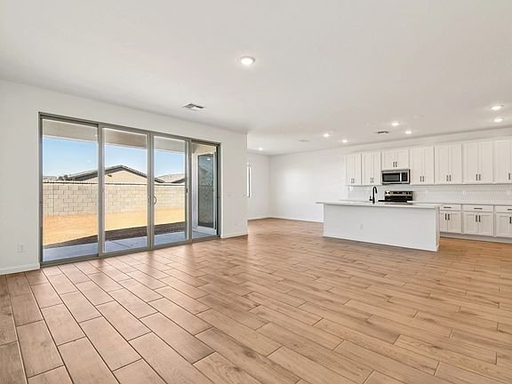 Great room, kitchen and dining. Not actual home, finishes and options may vary.