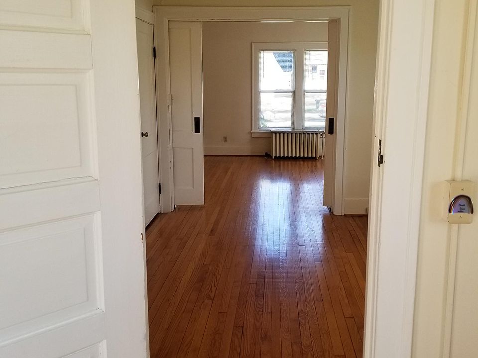 Looking into bedroom, living room through double doors