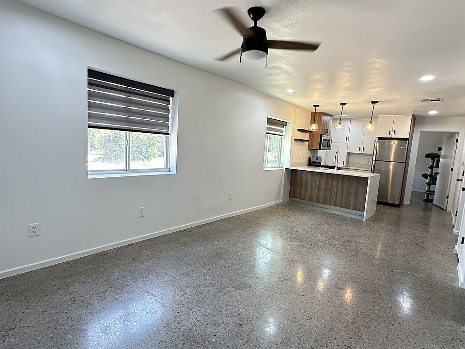 Open plan spacious living room with luxury concrete polished floors.